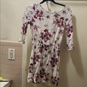 Dress above knee length, long sleeve.